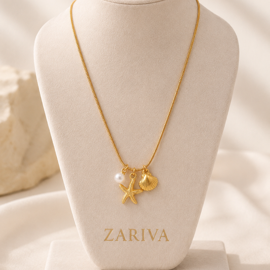 Marina Pearl Starfish Charm Necklace by Zariva, 18K gold PVD anti-tarnish necklace with ocean inspired shell and pearl charms for women