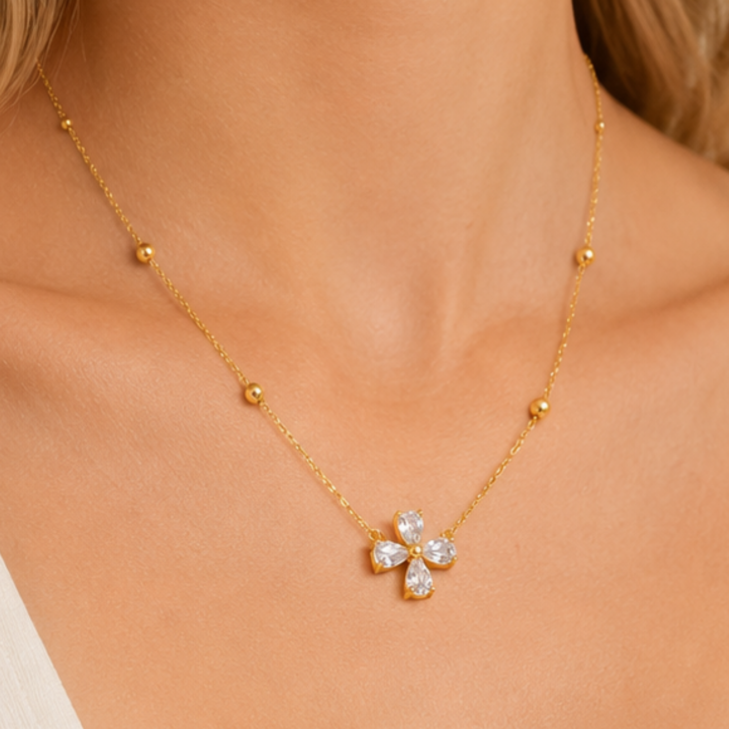 Zariva Clover Beaded Necklace in 18K Gold PVD plated SS316L stainless steel featuring a sparkling four-leaf crystal clover pendant with elegant beaded chain. Anti-tarnish, water-resistant, hypoallergenic everyday luxury jewellery for women.