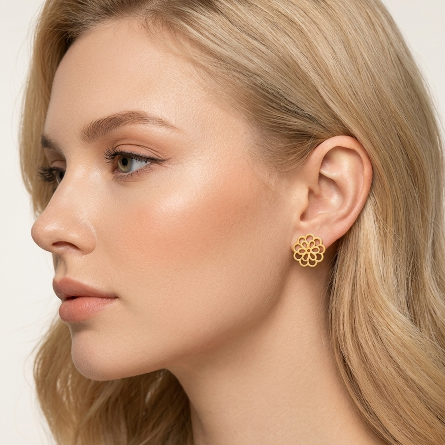 ZARIVA Floral Mini Gold Stud Earrings for women crafted from SS316L stainless steel with 18K PVD gold plating. Anti-tarnish, waterproof, lightweight flower stud earrings under 1 cm for everyday wear, office, college and gifting.