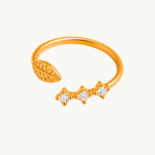 Zariva Leaf Spark Zircon Ring in 18K Gold PVD plated SS316L stainless steel featuring an elegant leaf motif with sparkling zircon stones. Anti-tarnish, water-resistant, hypoallergenic adjustable everyday luxury ring for women.