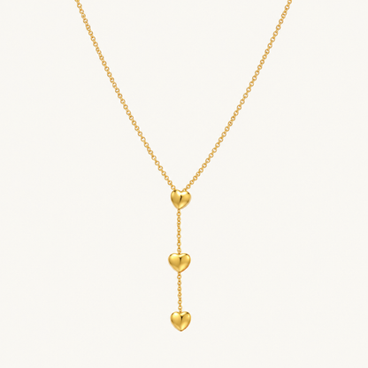 Amora Double Heart Lariat Necklace in gold with two cascading heart pendants and a delicate lariat chain by ZARIVA.