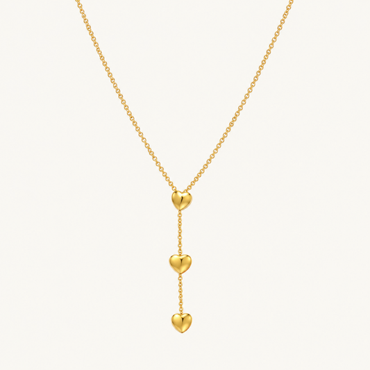 Amora Double Heart Lariat Necklace in gold with two cascading heart pendants and a delicate lariat chain by ZARIVA.