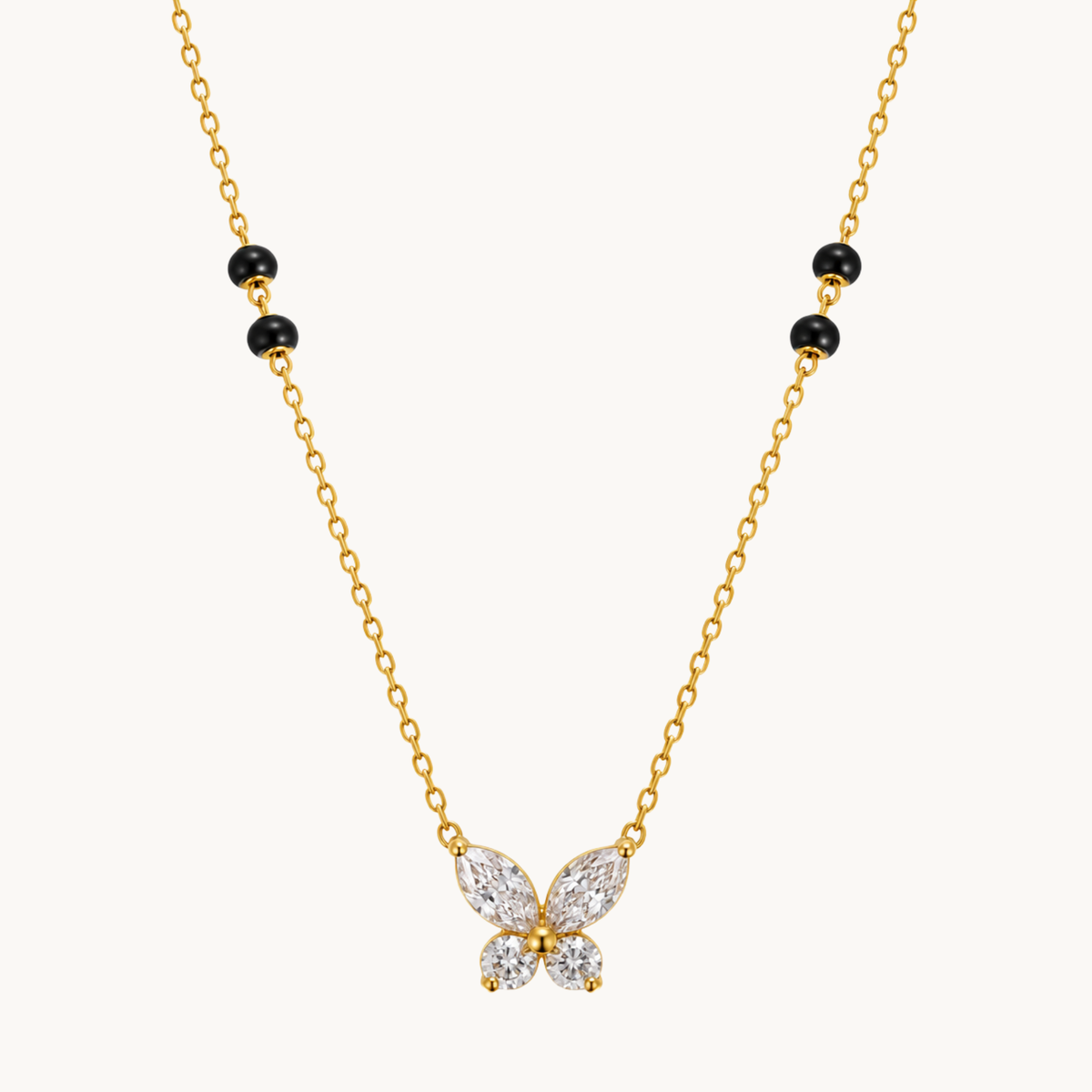 Butterfly mangalsutra featuring a sparkling four-wing pendant, black beads and a gold-tone chain by ZARIVA