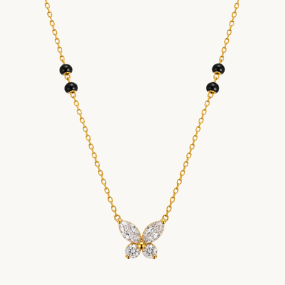 Butterfly mangalsutra featuring a sparkling four-wing pendant, black beads and a gold-tone chain by ZARIVA