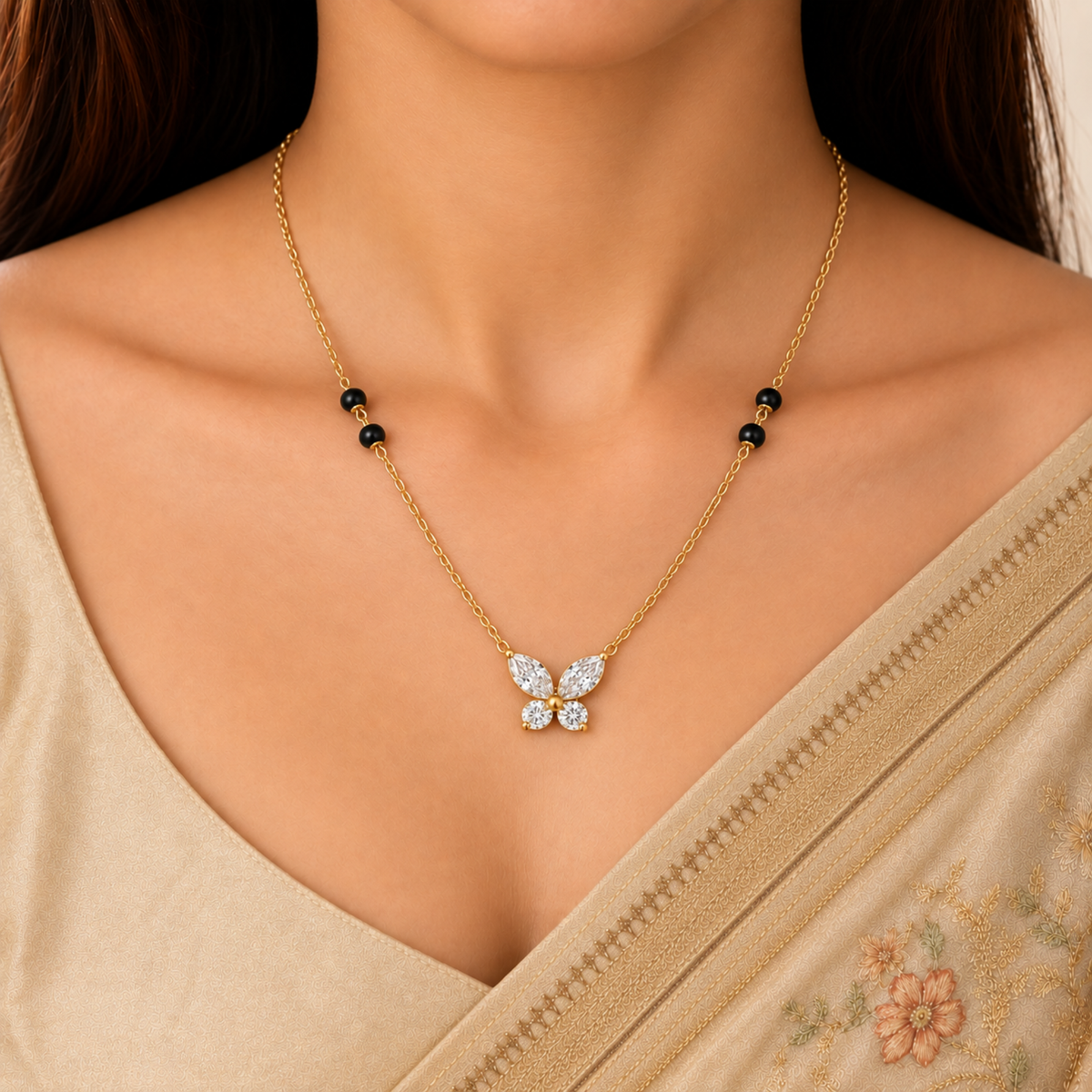 Butterfly mangalsutra styled with an elegant Indian saree, featuring sparkling crystal wings and black bead accents