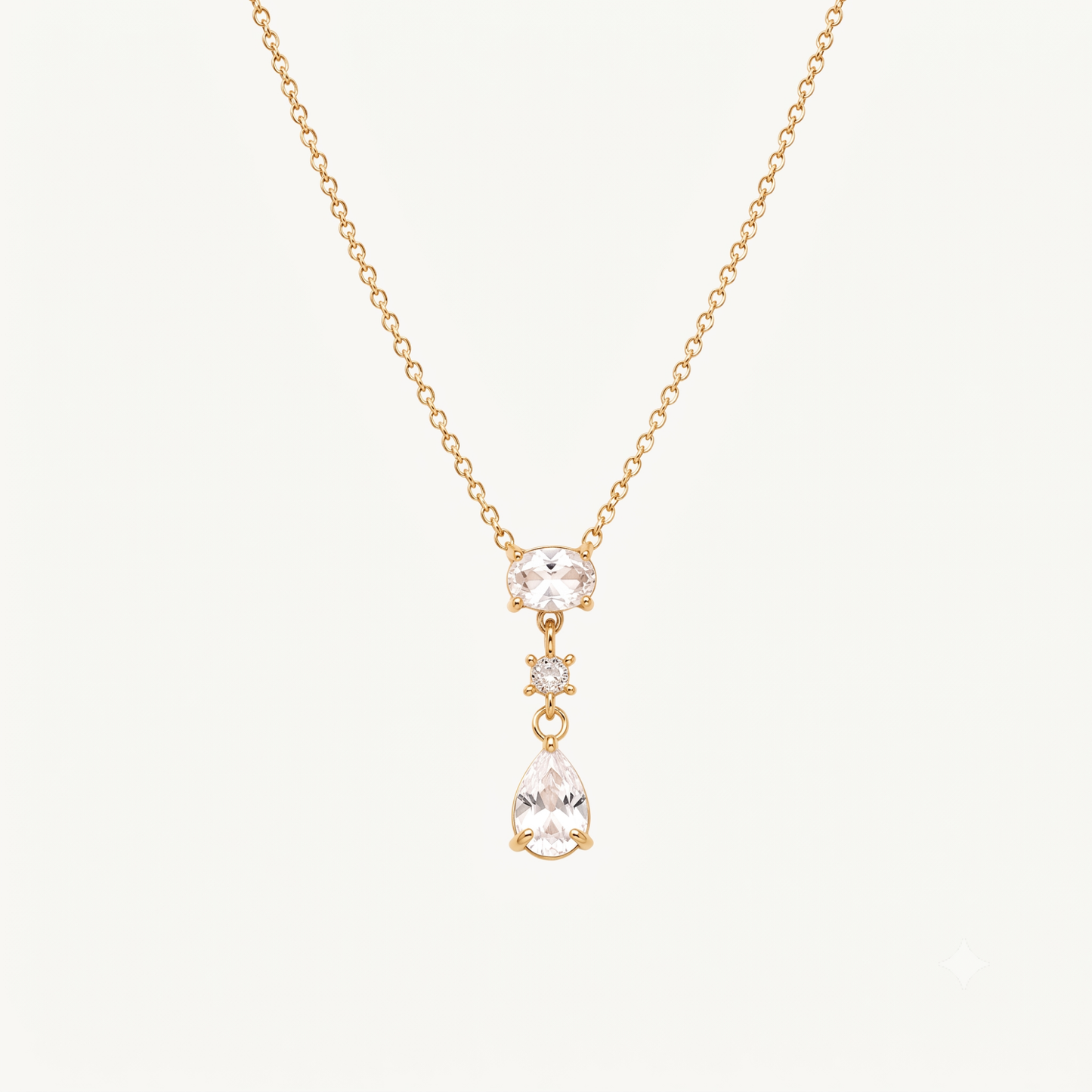 Crystal teardrop pendant necklace with an oval crystal centre, round accent stone and elegant gold-tone chain by ZARIVA.