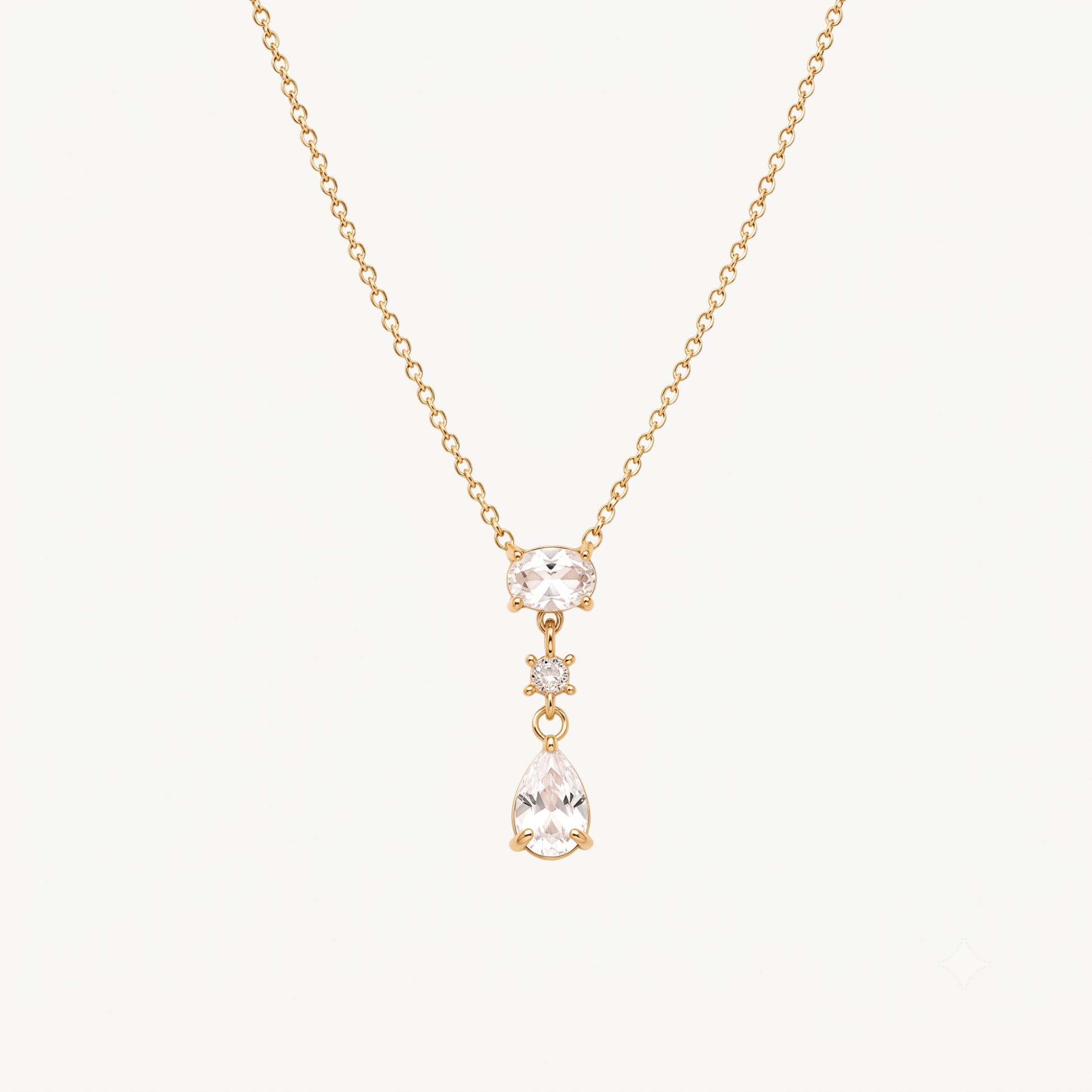 Crystal teardrop pendant necklace with an oval crystal centre, round accent stone and elegant gold-tone chain by ZARIVA.
