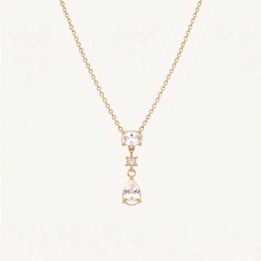 Crystal teardrop pendant necklace with an oval crystal centre, round accent stone and elegant gold-tone chain by ZARIVA.