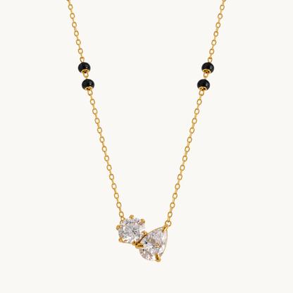 Duo crystal mangalsutra featuring sparkling dual stones, gold-tone detailing and black beads in a refined modern design.
