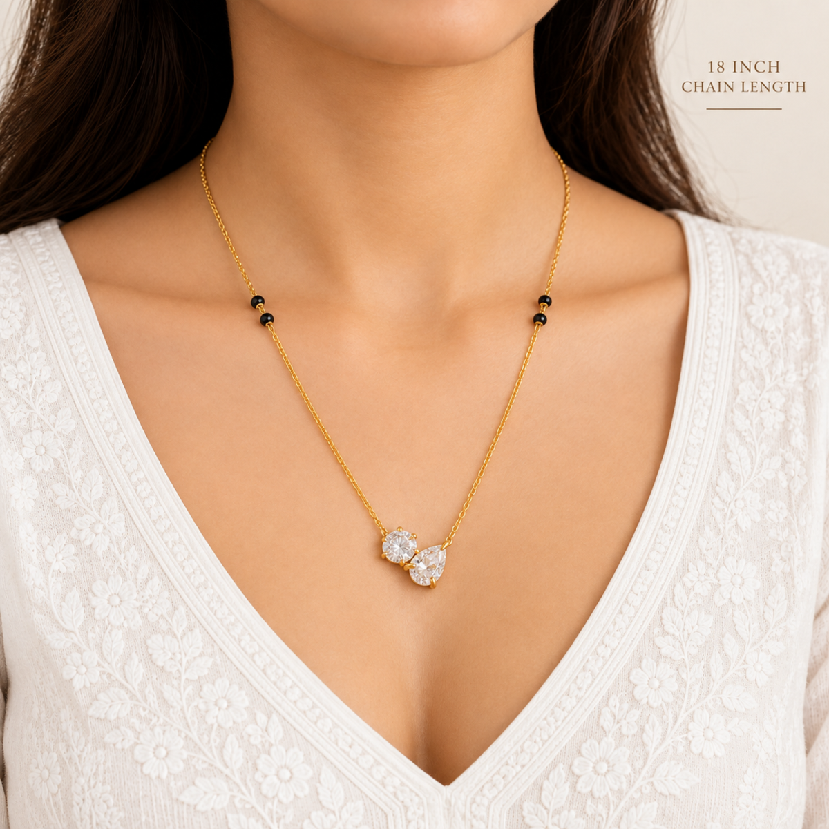 Duo crystal mangalsutra with sparkling round and pear-shaped stones on a gold-tone chain, styled for everyday wear by ZARIVA.