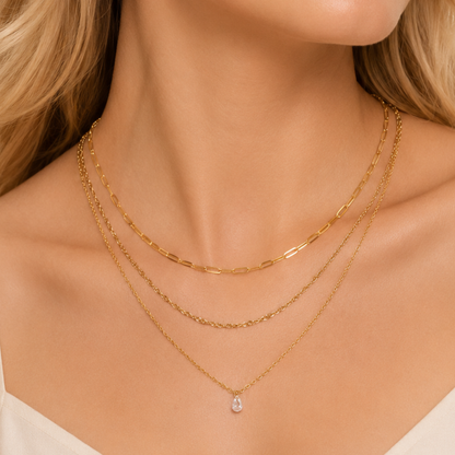 Gold crystal necklace for women with three delicate layers and a clear drop charm, styled by ZARIVA for everyday elegance.
