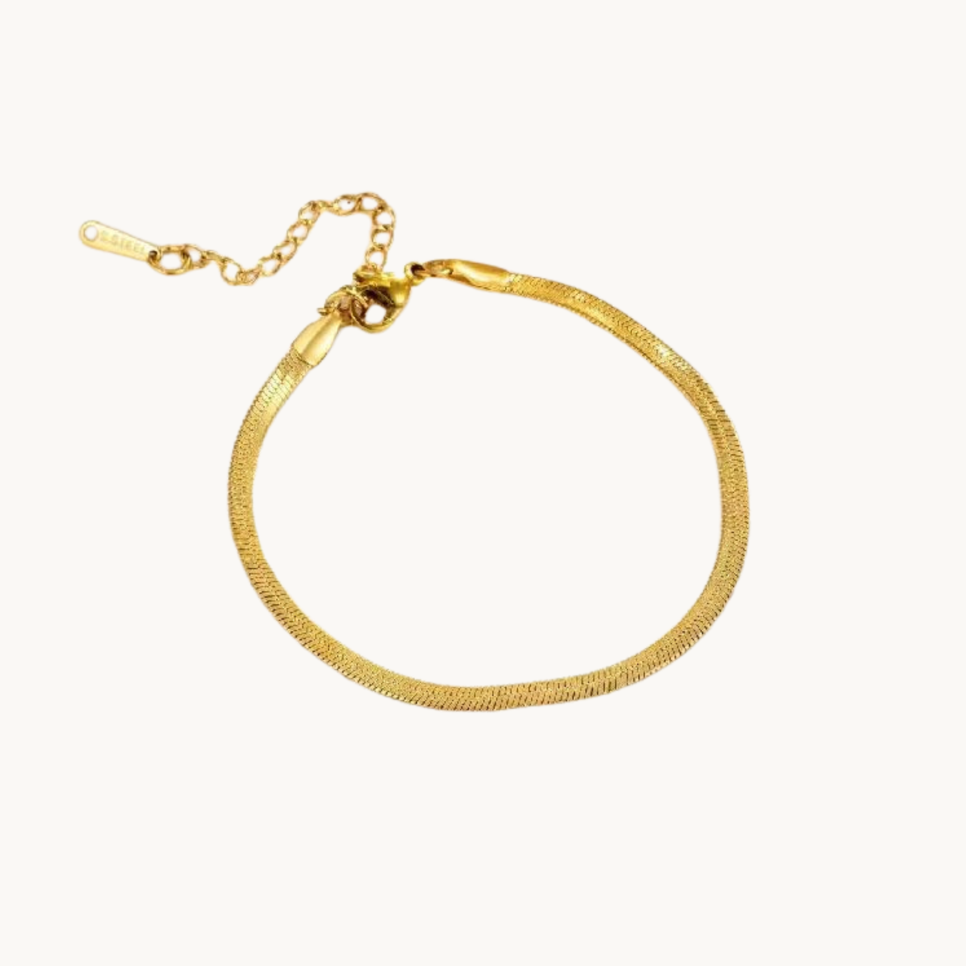 Gold herringbone bracelet with a sleek flat chain design, adjustable extender and polished finish by Zariva