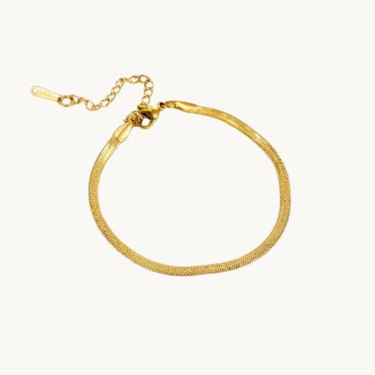 Gold herringbone bracelet with a sleek flat chain design, adjustable extender and polished finish by Zariva