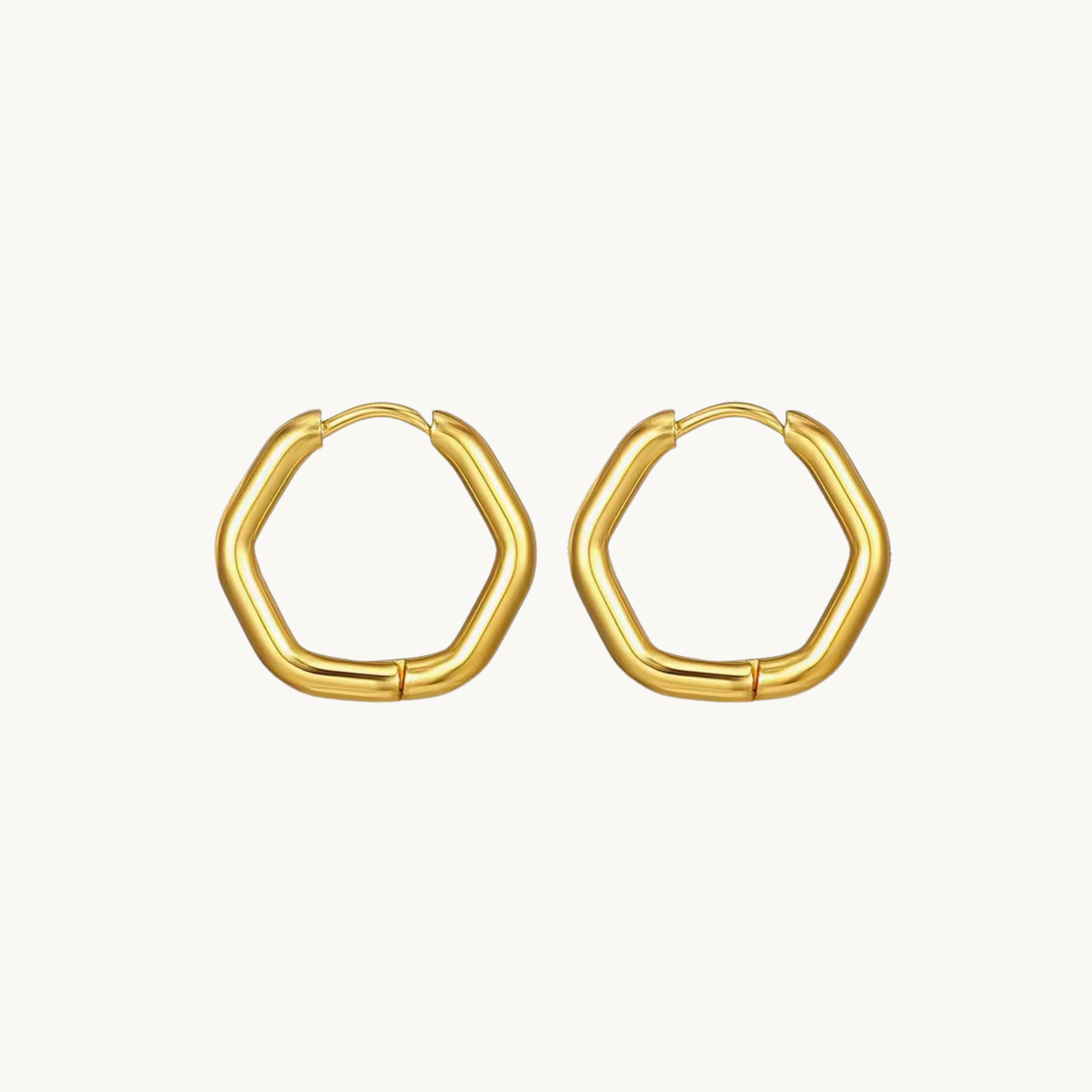 Gold hexagon hoop earrings with a smooth rounded geometric silhouette and polished finish for contemporary styling by ZARIVA.