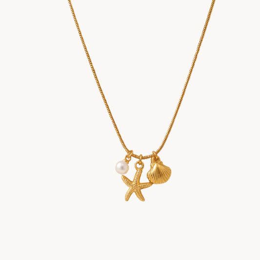 Marina Pearl Starfish Charm Necklace by Zariva, 18K gold PVD anti-tarnish necklace with ocean inspired shell and pearl charms for women