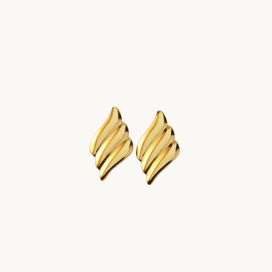 Gold statement earrings with a sculptural layered design, showcasing polished golden curves for an elegant contemporary look by ZARIVA.