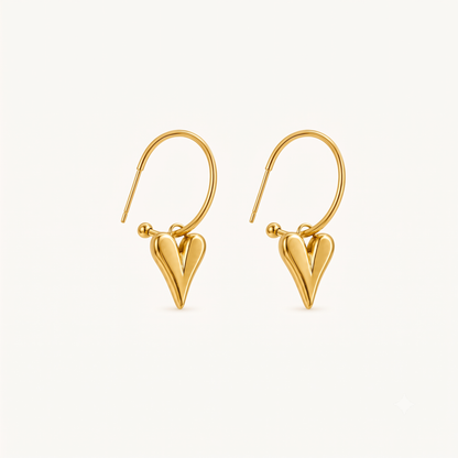 Gold heart earrings featuring sleek open hoops and polished sculptural heart drops, presented as elegant drop earrings by ZARIVA.