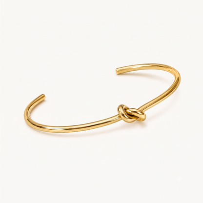 Knot cuff bracelet in polished gold with an elegant intertwined knot design for a minimalist everyday jewellery look by ZARIVA.
