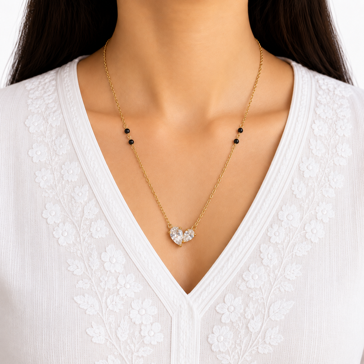 ZARIVA mangalsutra with a delicate open heart crystal pendant styled for elegant everyday wear.
