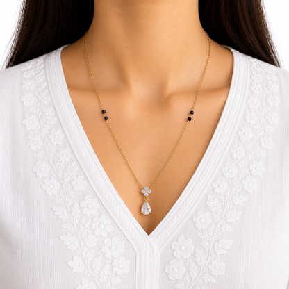 ZARIVA mangalsutra featuring a delicate crystal cluster and teardrop pendant styled for elegant everyday wear.