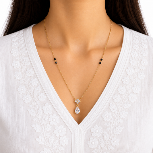 ZARIVA mangalsutra featuring a delicate crystal cluster and teardrop pendant styled for elegant everyday wear.