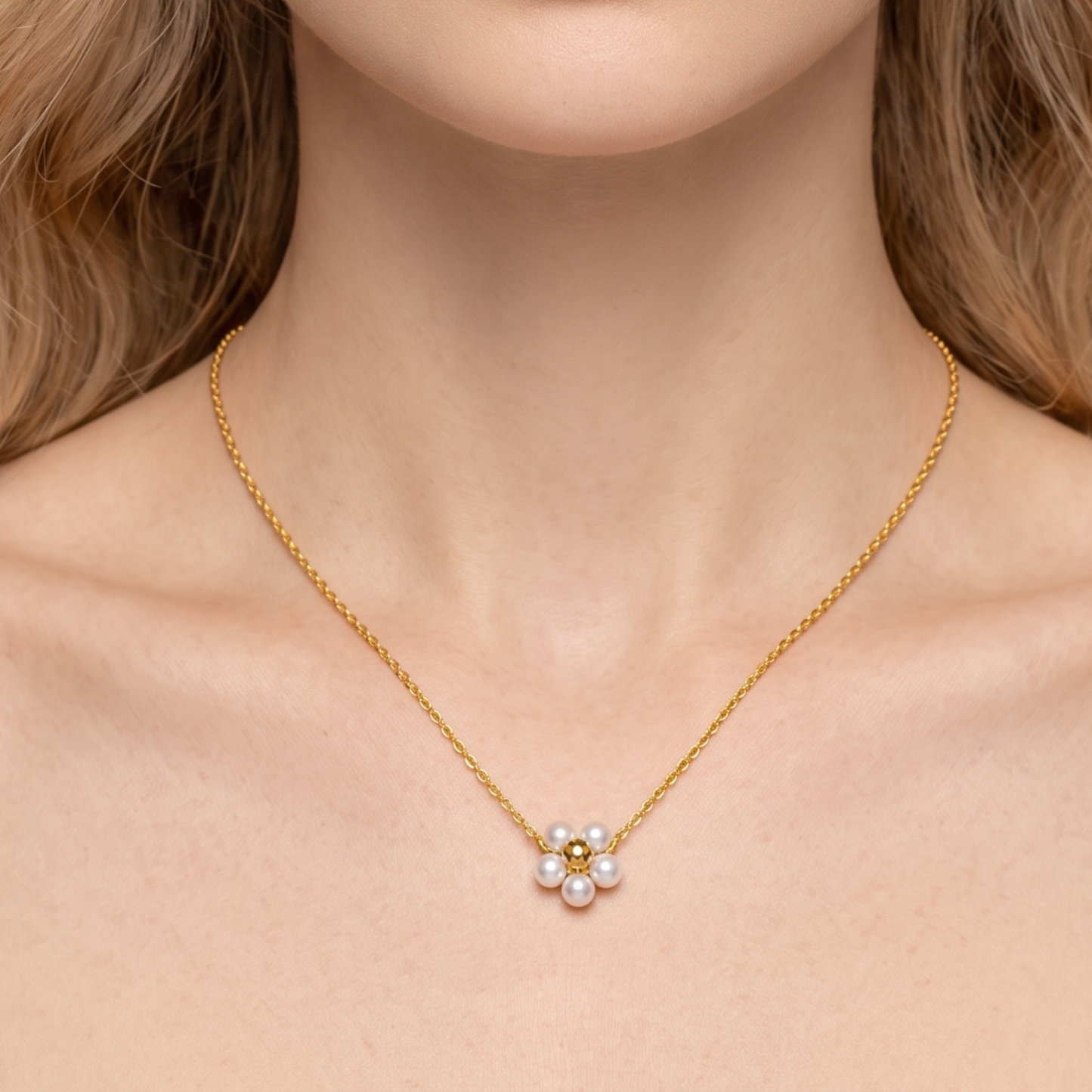 Pearl Blossom Pendant Necklace worn on a woman, highlighting its delicate gold-tone chain and elegant floral pearl pendant.