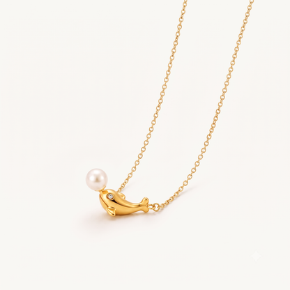 Pearl dolphin necklace featuring a polished gold dolphin pendant, white pearl accent and delicate gold chain by ZARIVA.