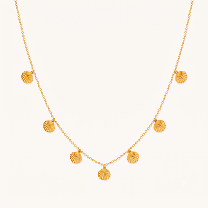 Seashell necklace with multiple gold shell charms on a delicate chain, showcasing ZARIVA's elegant coastal-inspired jewellery design.