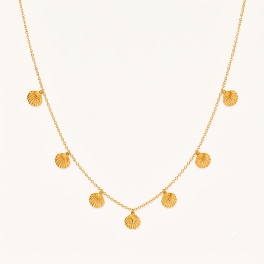 Seashell necklace with multiple gold shell charms on a delicate chain, showcasing ZARIVA's elegant coastal-inspired jewellery design.