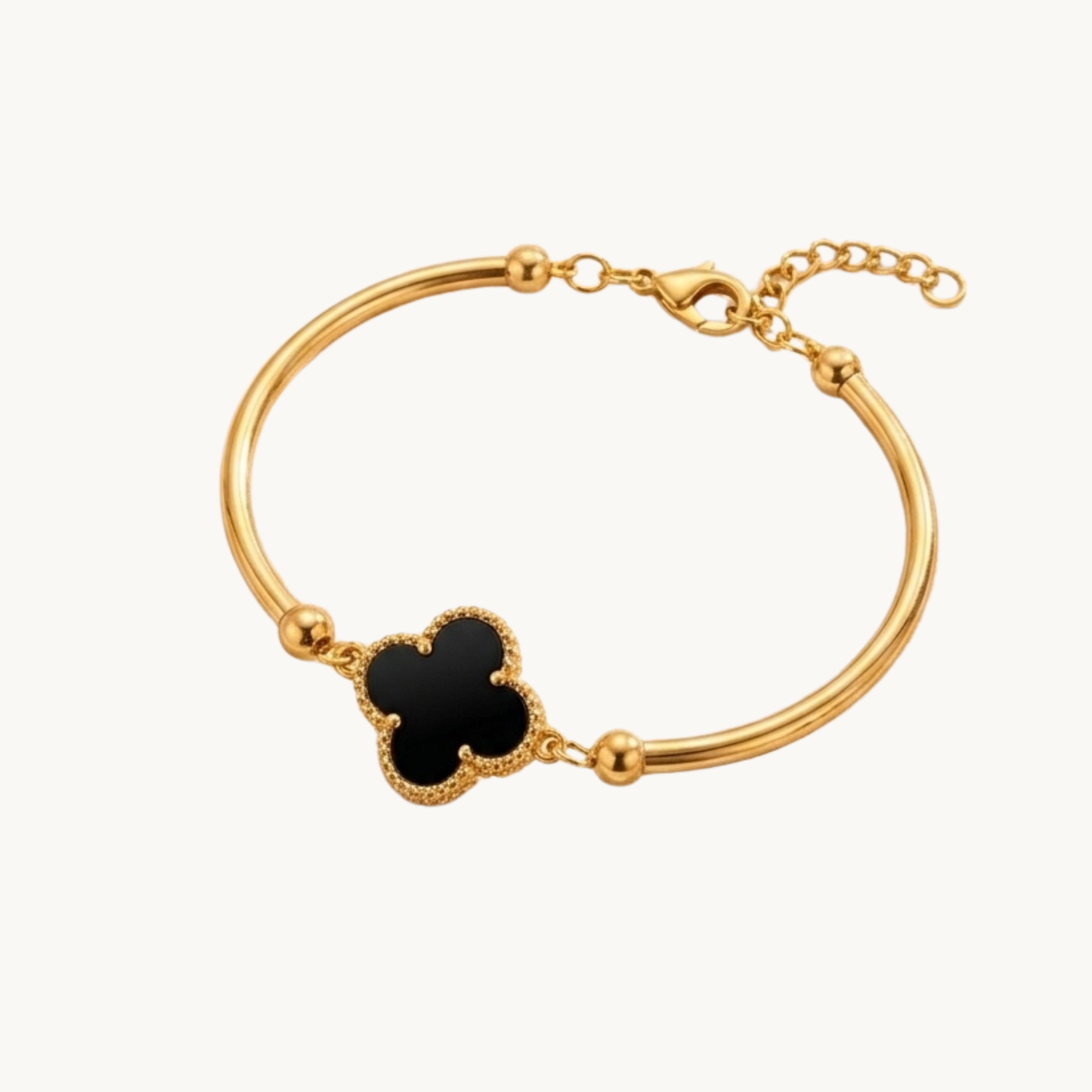 Woman wearing Serena Clover Luxe Bracelet with black clover charm, gold finish and skin-friendly everyday jewellery by Zariva