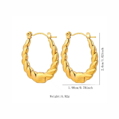 Vintage hoop earrings featuring an elongated silhouette and sculpted twisted texture for a distinctive polished look by ZARIVA.