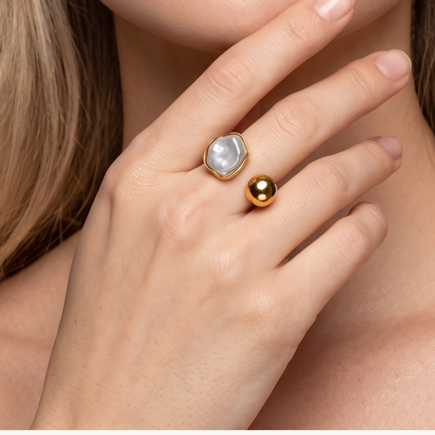 White stone open ring with a polished gold finish and sculptural design, shown against a clean background by ZARIVA.