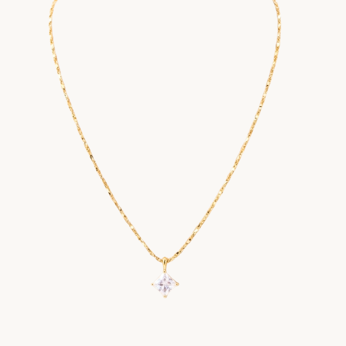Zariva Aurora Rhombus Solitaire Necklace in 18K Gold PVD plated SS316L stainless steel featuring a brilliant rhombus-cut solitaire crystal pendant. Anti-tarnish, water-resistant, hypoallergenic everyday luxury jewellery for women.