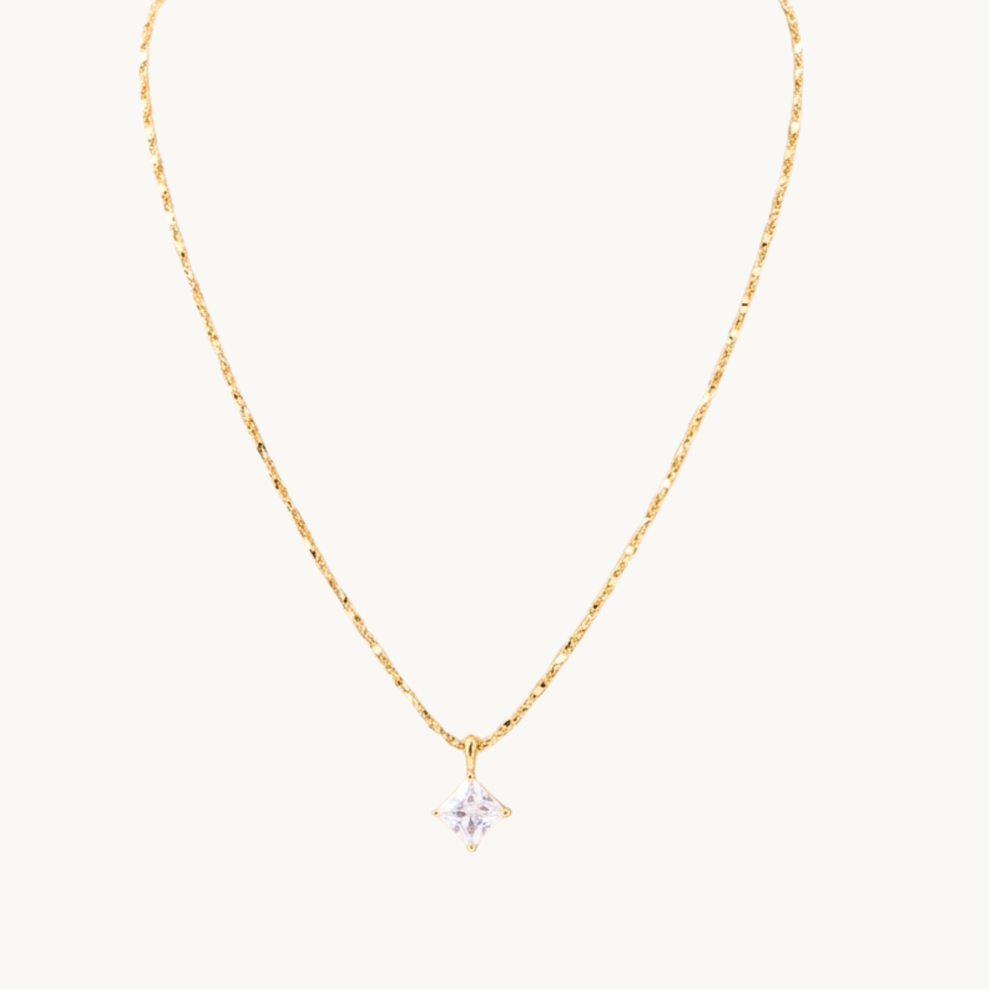Zariva Aurora Rhombus Solitaire Necklace in 18K Gold PVD plated SS316L stainless steel featuring a brilliant rhombus-cut solitaire crystal pendant. Anti-tarnish, water-resistant, hypoallergenic everyday luxury jewellery for women.
