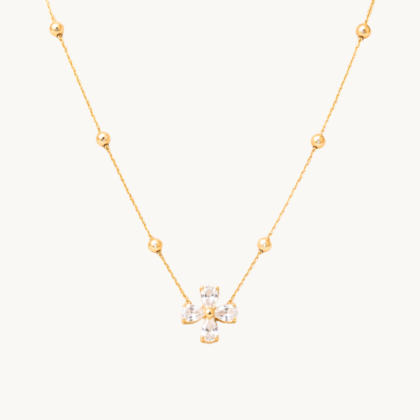 Zariva Clover Beaded Necklace in 18K Gold PVD plated SS316L stainless steel featuring a sparkling four-leaf crystal clover pendant with elegant beaded chain. Anti-tarnish, water-resistant, hypoallergenic everyday luxury jewellery for women.