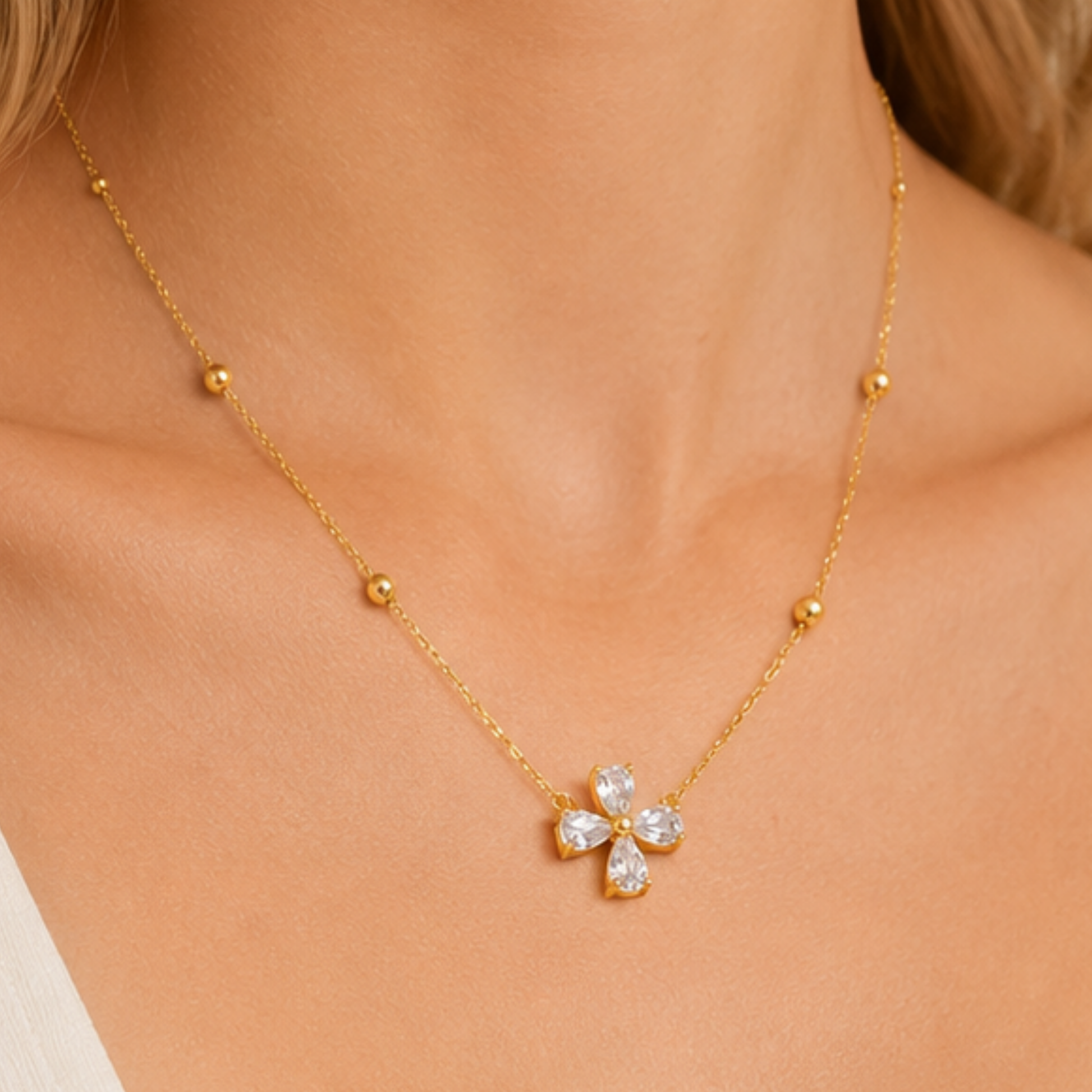 Zariva Clover Beaded Necklace in 18K Gold PVD plated SS316L stainless steel featuring a sparkling four-leaf crystal clover pendant with elegant beaded chain. Anti-tarnish, water-resistant, hypoallergenic everyday luxury jewellery for women.