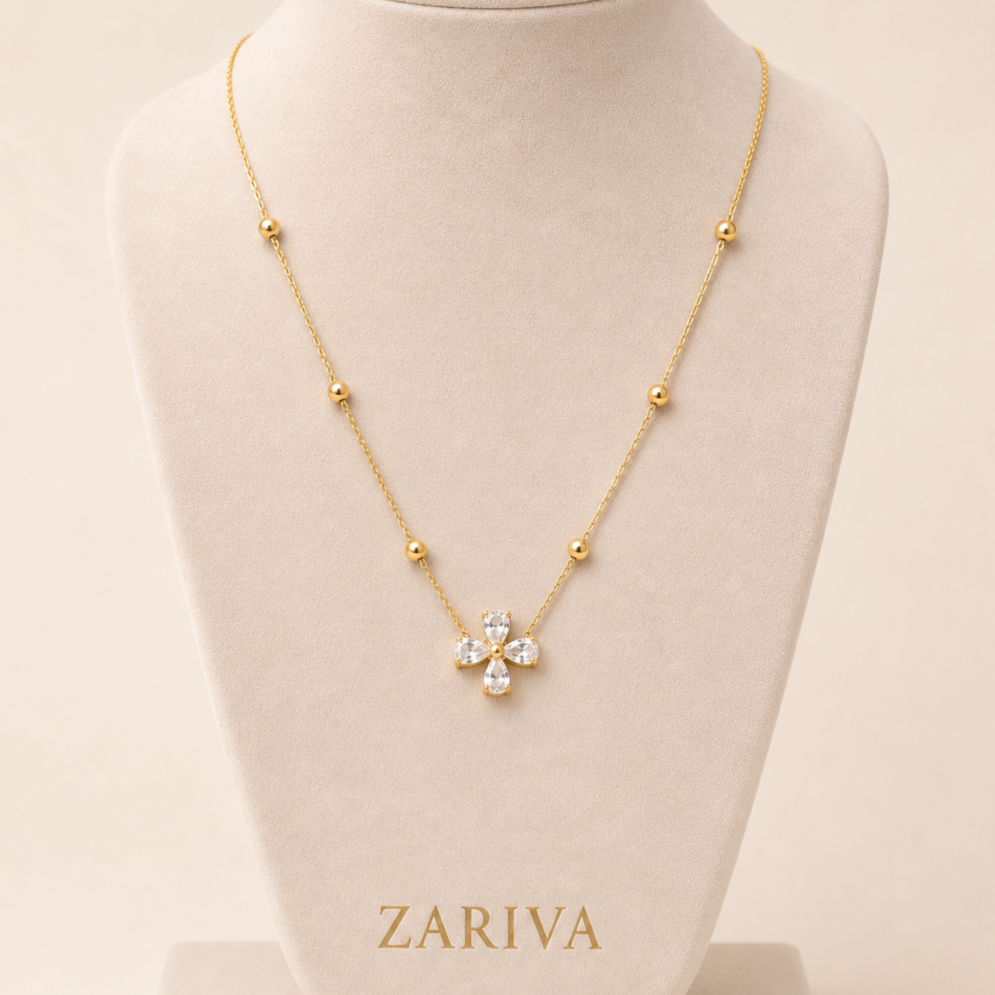 Zariva Clover Beaded Necklace in 18K Gold PVD plated SS316L stainless steel featuring a sparkling four-leaf crystal clover pendant with elegant beaded chain. Anti-tarnish, water-resistant, hypoallergenic everyday luxury jewellery for women.