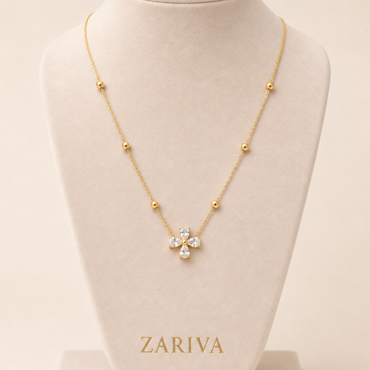 Zariva Clover Beaded Necklace in 18K Gold PVD plated SS316L stainless steel featuring a sparkling four-leaf crystal clover pendant with elegant beaded chain. Anti-tarnish, water-resistant, hypoallergenic everyday luxury jewellery for women.