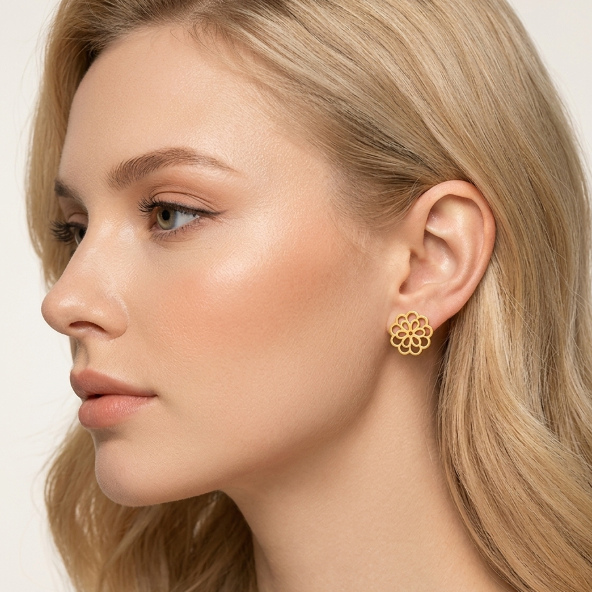 ZARIVA Floral Mini Gold Stud Earrings for women crafted from SS316L stainless steel with 18K PVD gold plating. Anti-tarnish, waterproof, lightweight flower stud earrings under 1 cm for everyday wear, office, college and gifting.