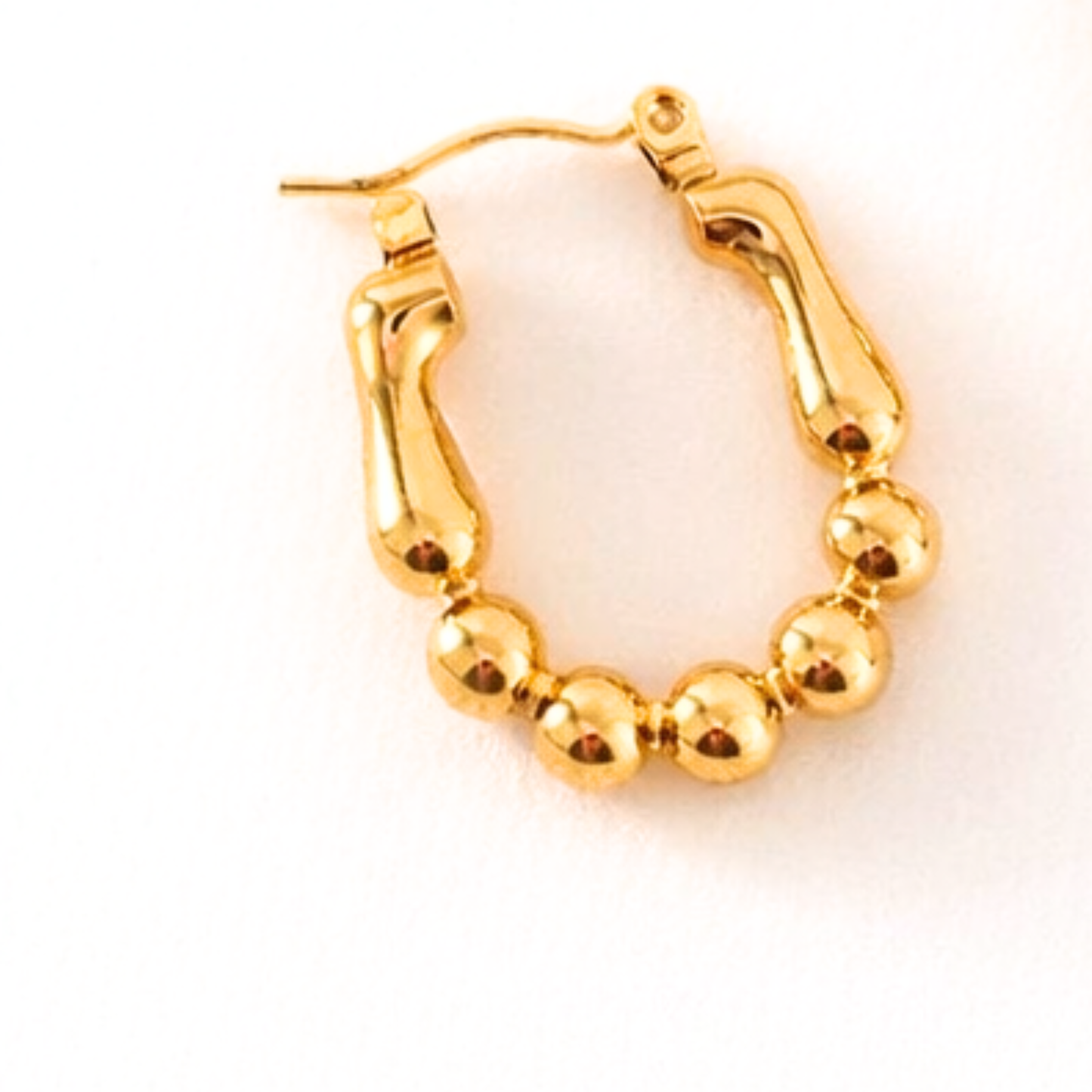 Kiara U Shape Bead Gold Hoops Earrings detailed texture closeup