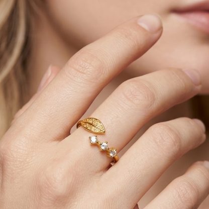 Zariva Leaf Spark Zircon Ring in 18K Gold PVD plated SS316L stainless steel featuring an elegant leaf motif with sparkling zircon stones. Anti-tarnish, water-resistant, hypoallergenic adjustable everyday luxury ring for women.