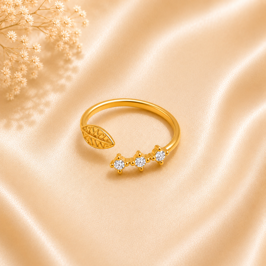 Zariva Leaf Spark Zircon Ring in 18K Gold PVD plated SS316L stainless steel featuring an elegant leaf motif with sparkling zircon stones. Anti-tarnish, water-resistant, hypoallergenic adjustable everyday luxury ring for women.