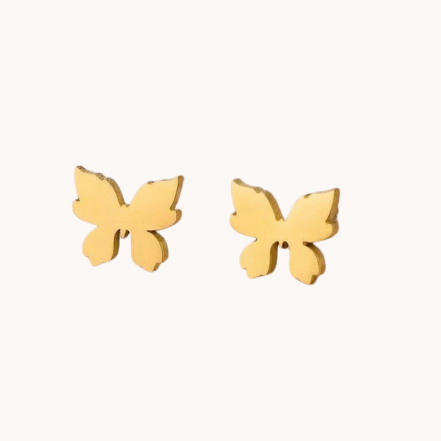 ZARIVA Mariposa Mini Butterfly Stud Earrings for women crafted from premium SS316L stainless steel with 18K PVD gold plating. Anti-tarnish, waterproof, lightweight butterfly stud earrings under 1 cm for everyday wear.