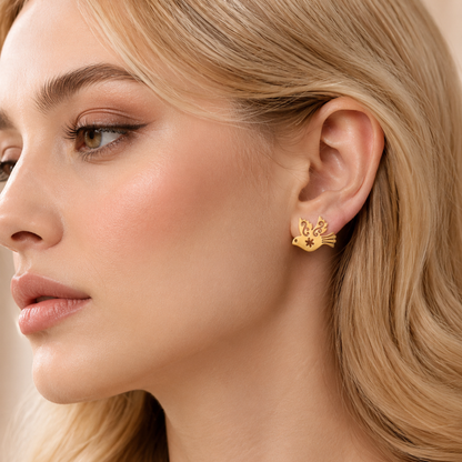 ZARIVA Paloma Élan Peace Dove Mini Stud Earrings displayed on a satin background. Premium SS316L stainless steel earrings with 18K PVD gold plating, anti-tarnish finish and elegant dove design.