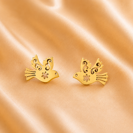 ZARIVA Paloma Élan Peace Dove Mini Stud Earrings for women crafted from premium SS316L stainless steel with 18K PVD gold plating. Anti-tarnish, waterproof, lightweight bird stud earrings under 1 cm for everyday wear.