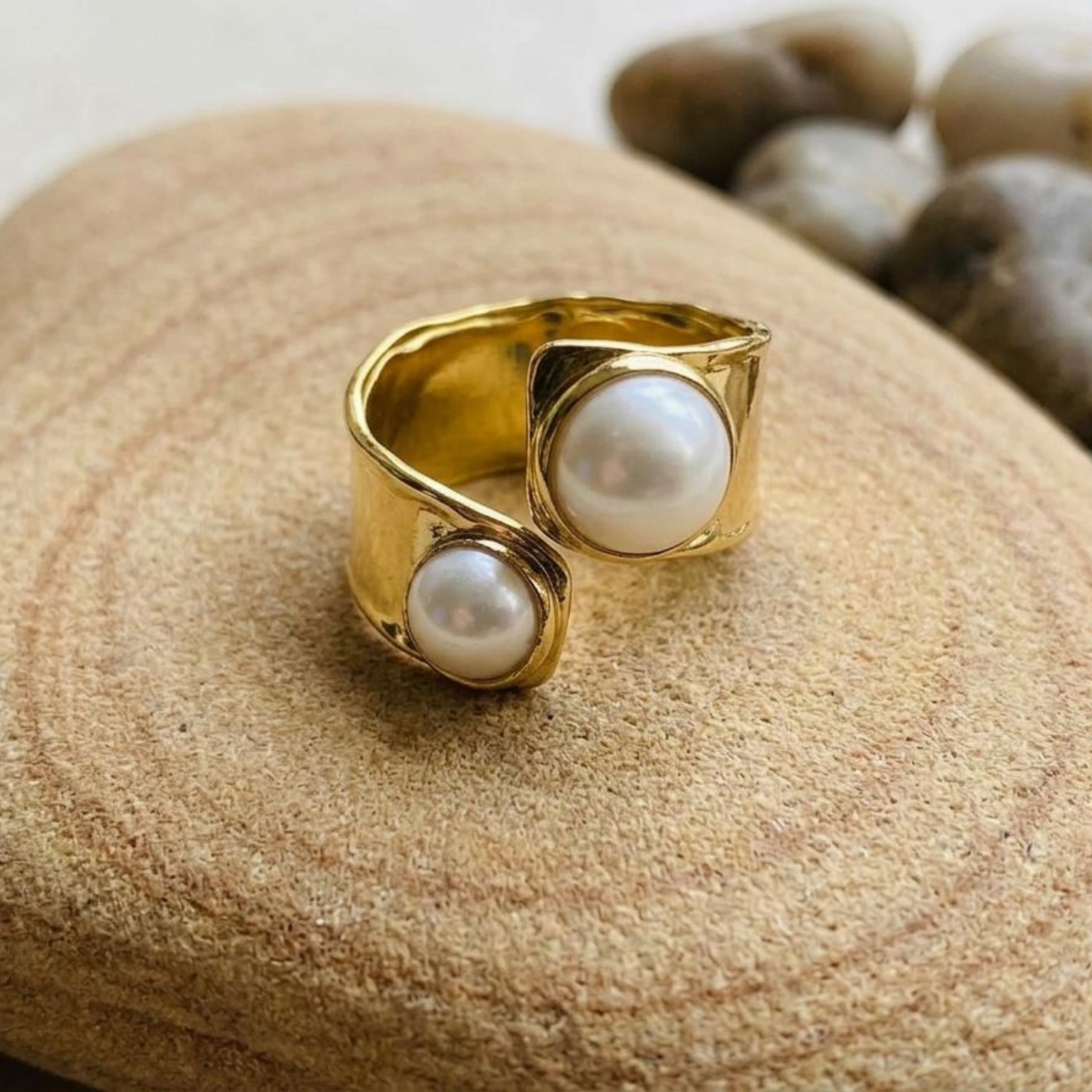 Zariva Pearl Embrace Open Ring in 18K Gold PVD plated SS316L stainless steel featuring an elegant open-band design with dual lustrous pearl accents. Anti-tarnish, water-resistant, hypoallergenic adjustable everyday luxury ring for women.