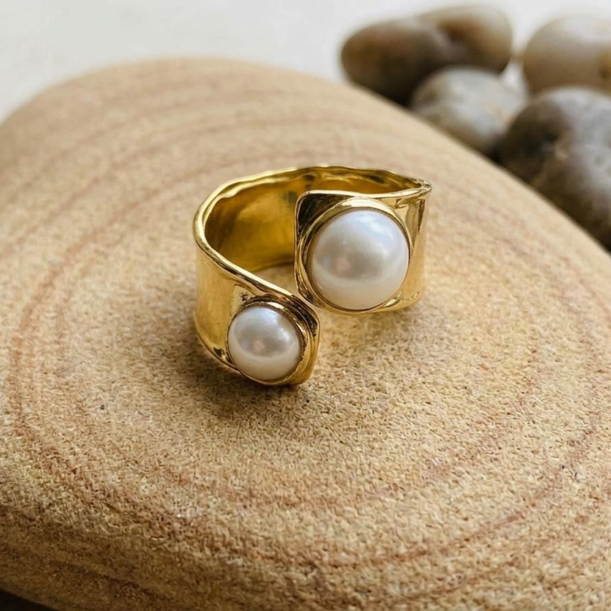 Zariva Pearl Embrace Open Ring in 18K Gold PVD plated SS316L stainless steel featuring an elegant open-band design with dual lustrous pearl accents. Anti-tarnish, water-resistant, hypoallergenic adjustable everyday luxury ring for women.